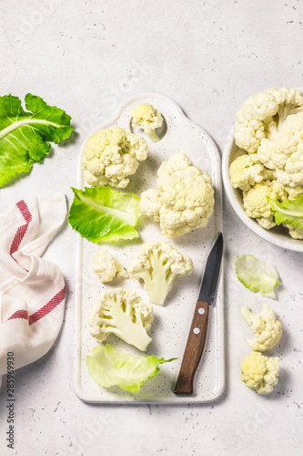 Chopped cauliflower on cutting board. Top view, copy space.