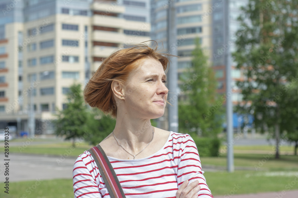 Portrait of a middle-aged redhead woman with freckles Portrait of a middle-aged redhead woman with freckles