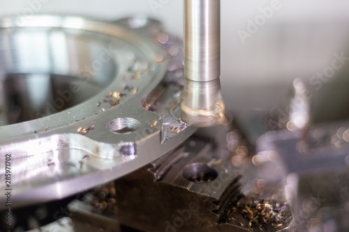 Canvas Print Milling a part on a CNC machine with a high-speed milling cutter.