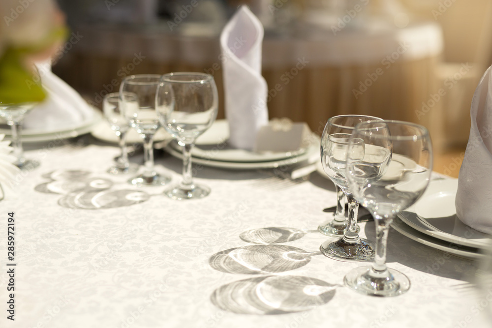tableware standing on a white festive table tableware standing on a white festive table