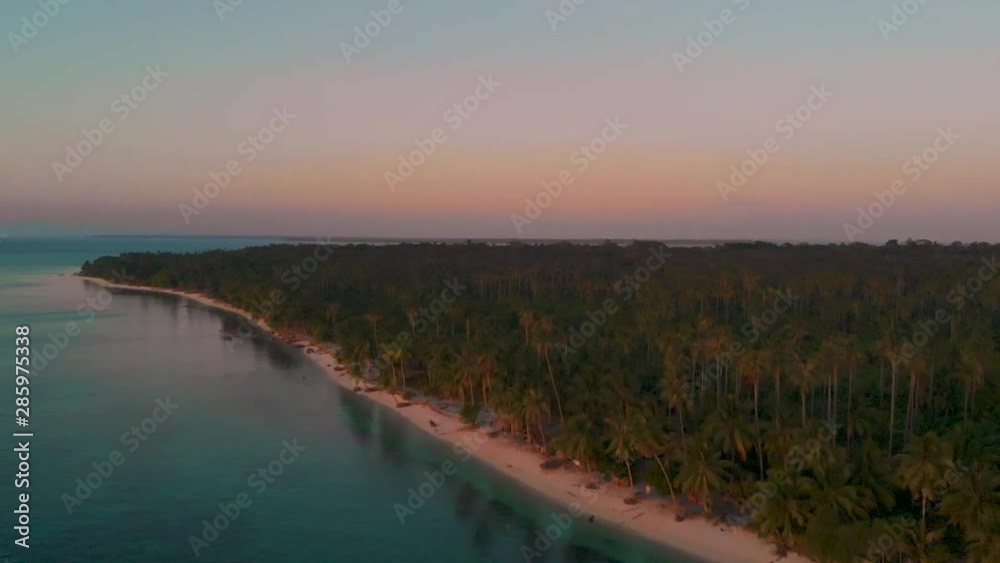 Aerial view of tropical paradise, coast of Candaraman island covered by palm trees in Balabac, Palawan, Philippines. Aerial view of tropical paradise, coast of Candaraman island covered by palm trees in Balabac, Palawan, Philippines.
