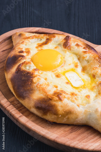 khachapuri or hachapuri with egg and cheese. Ajarian traditional flatbread. photo