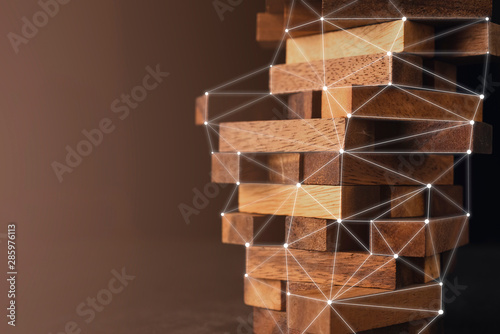 business organize management strategy ideas concept wood stack block tower arranging with dark background