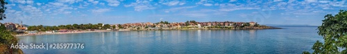 Seaside landscape, panorama, banner - view of the embankment with fortress wall and beach in the city of Sozopol on the Black Sea coast in Bulgaria