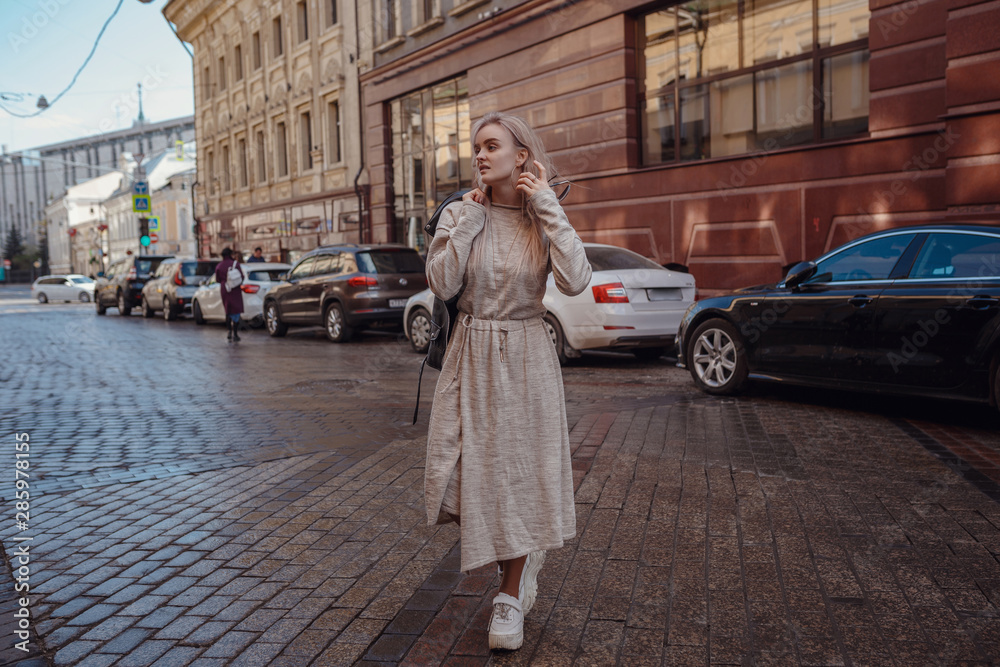 Beautiful woman walks through the streets of Moscow