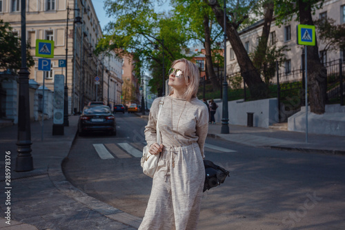 Beautiful woman walks through the streets of Moscow