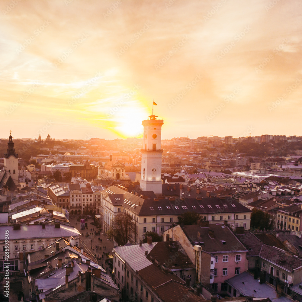 aerial view of sunset above european city