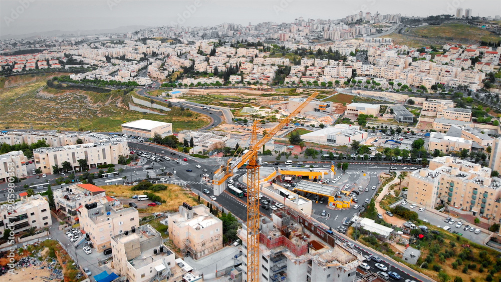 Jerusalem construction site and cranes Aerial view Flying over Cranes and construction site in Pisgat zeev North Jerusalem 