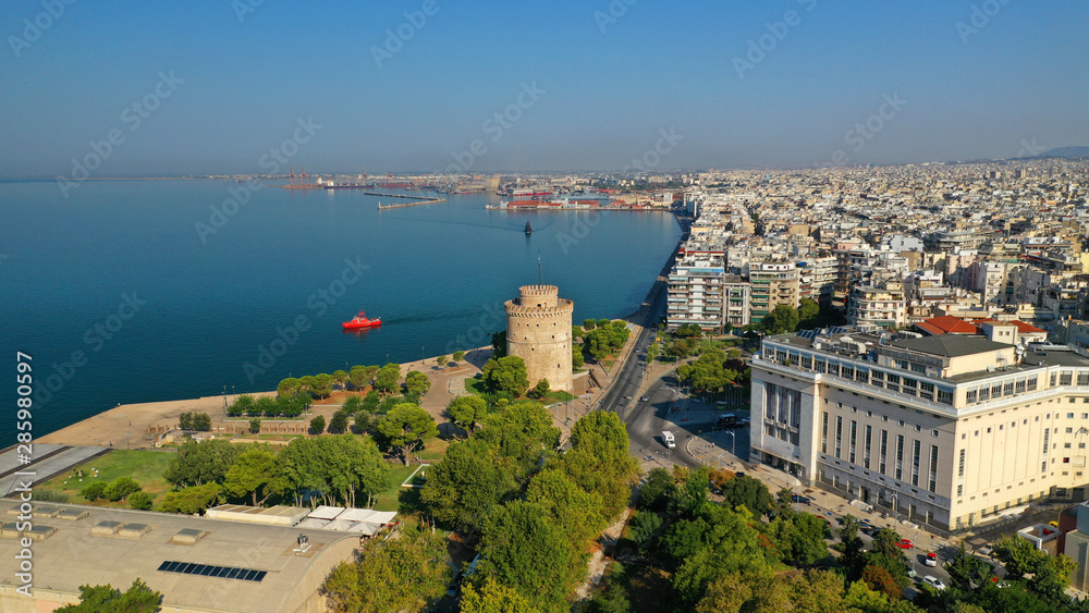 Aerial drone view of iconic historic landmark - old byzantine White Tower of Thessaloniki or Salonica, North Greece