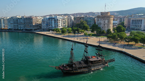 Aerial drone view of iconic historic landmark - old byzantine White Tower of Thessaloniki or Salonica, North Greece