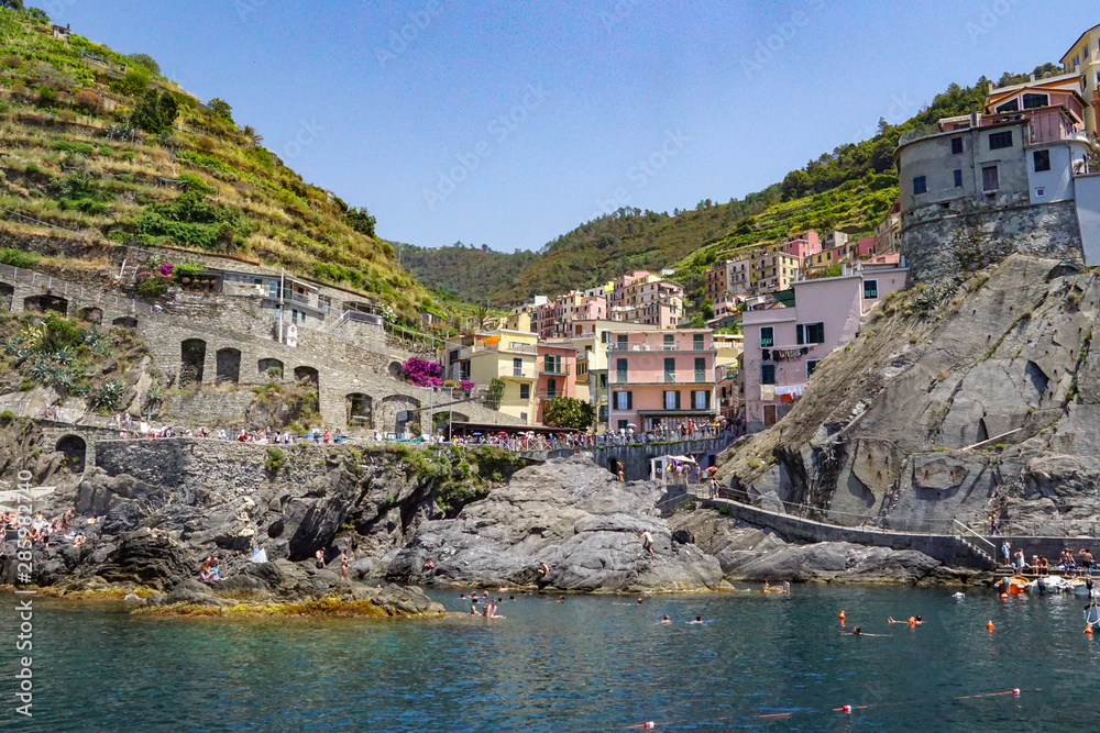 MANAROLA, ITALY - JULY 4, 2019: Beautiful fishing village in Cinque Terre with colorful facades and sea view 
