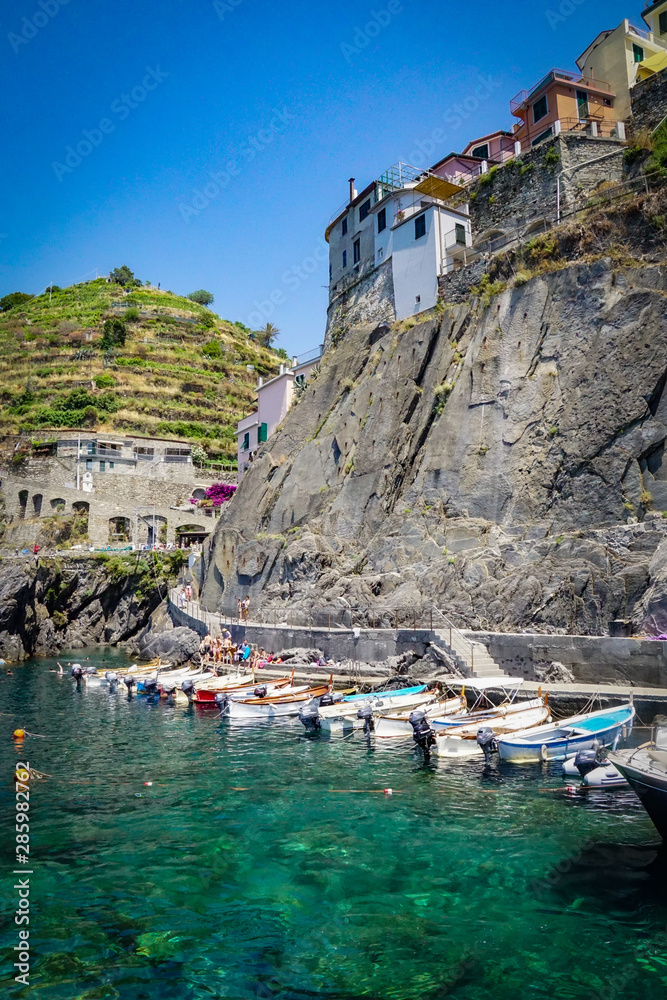 MANAROLA, ITALY - JULY 4, 2019: Beautiful fishing village in Cinque Terre with colorful facades and sea view 