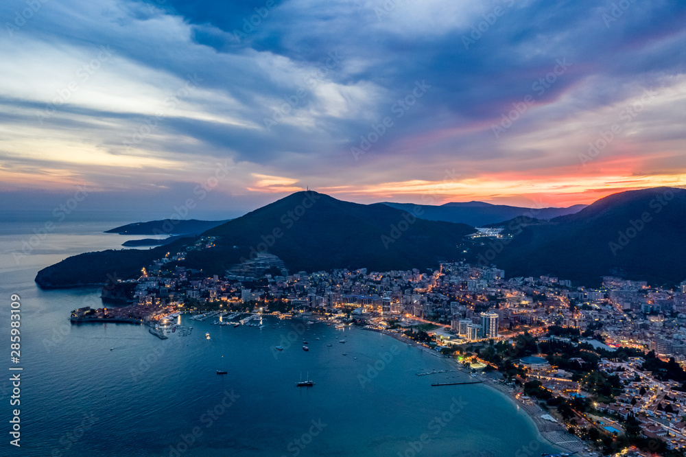 Aerial view of Budva, Montenegro on Adriatic coast after sunset.
