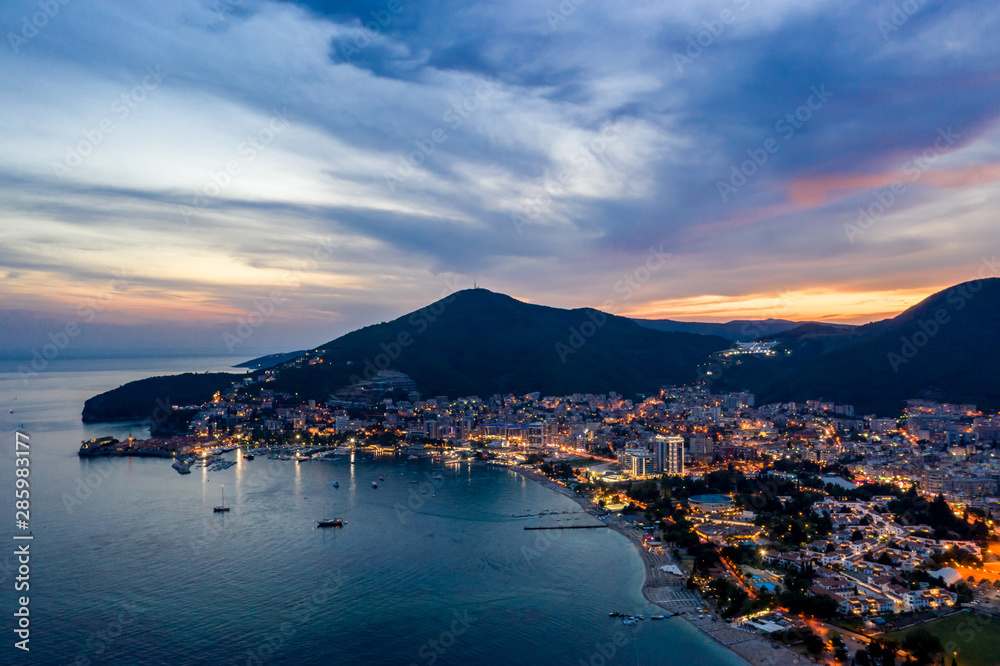 Aerial view of Budva, Montenegro on Adriatic coast after sunset.