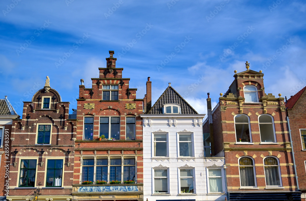 Architecture along the streets in the city of Delft in the Netherlands on a sunny day.