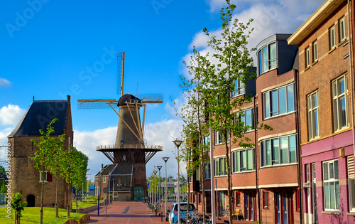 A windmill in the city of Delft in The Netherlands on a sunny day. photo