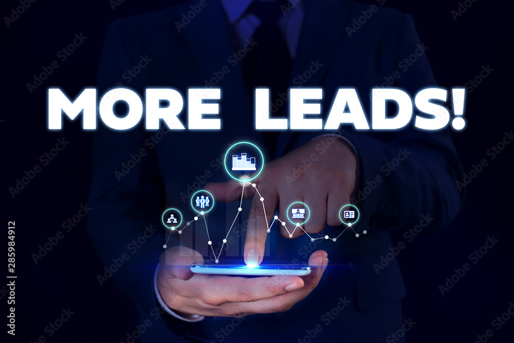 Writing note showing More Leads. Business concept for initiation of consumer interest or enquiry into product Male wear formal suit presenting presentation smart device Writing note showing More Leads. Business concept for initiation of consumer interest or enquiry into product Male wear formal suit presenting presentation smart device
