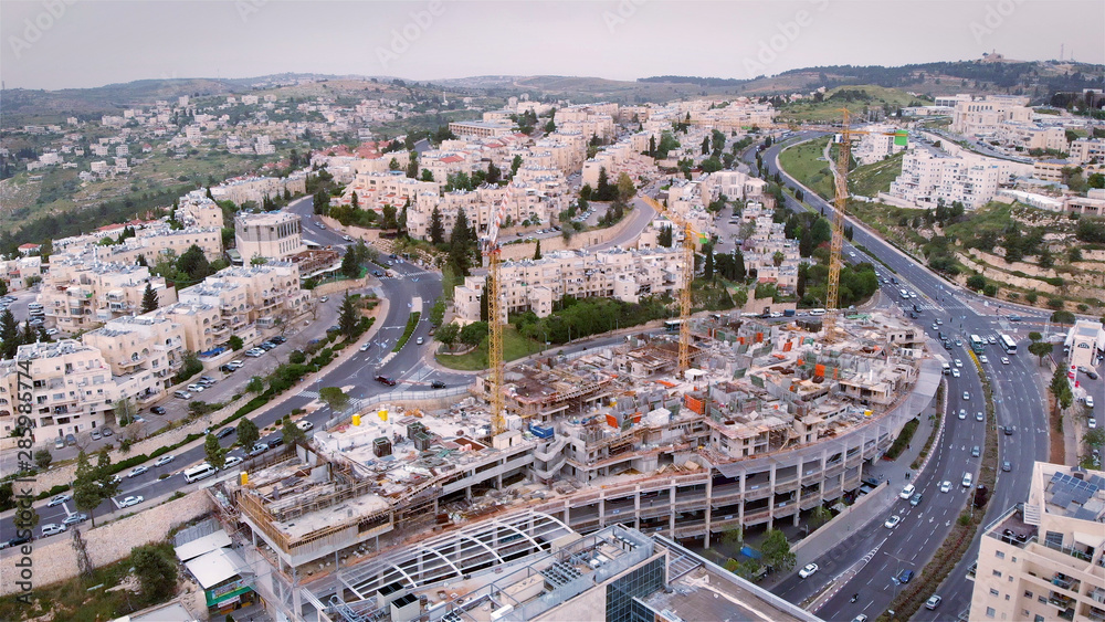 Jerusalem construction site and crane Aerial view Flying over Cranes and construction site in Jerusalem 