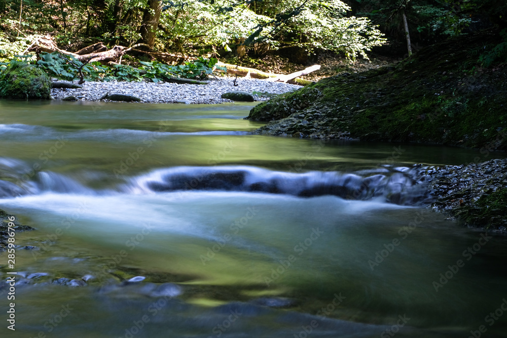 Naklejka premium Flowing cascades in the scenic eistobel Canyon in the bavarian Allgau, Germany, Europe