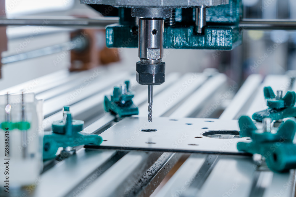 CNC milling machine cutting aluminium part. CNC milling machine cutting aluminium part.