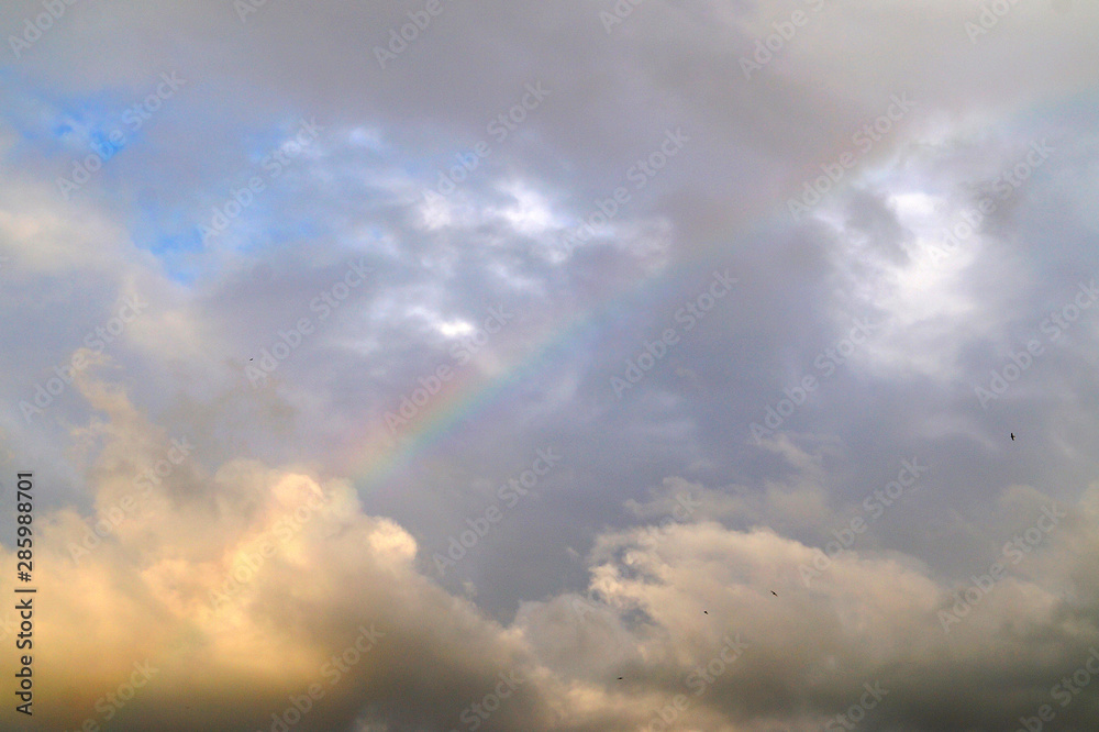 Beautiful rainbow on a cloudy sky after rain. Beautiful rainbow on a cloudy sky after rain.