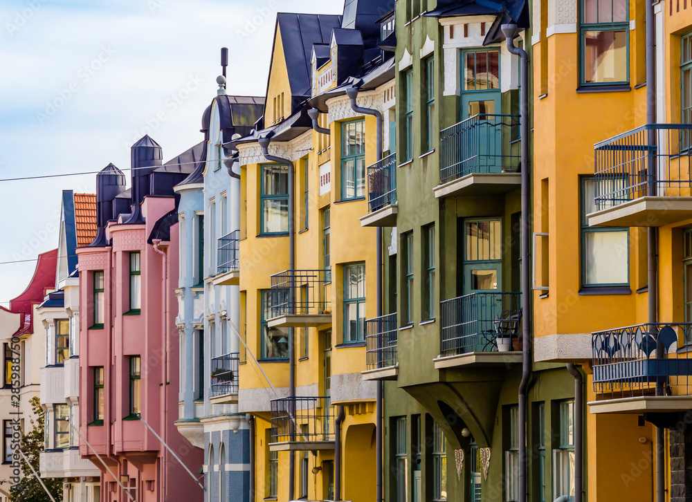 Helsinki, Finland, August 10, 2019: Colorful houses along the most beautiful street Huvilakatu in Helsinki, Finland