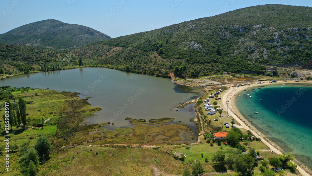 Fototapeta premium Aerial drone photo of iconic paradise bay and sandy beach of Porto Koufo with turquoise calm sea protected by winds, South Sithonia Peninsula, North Greece