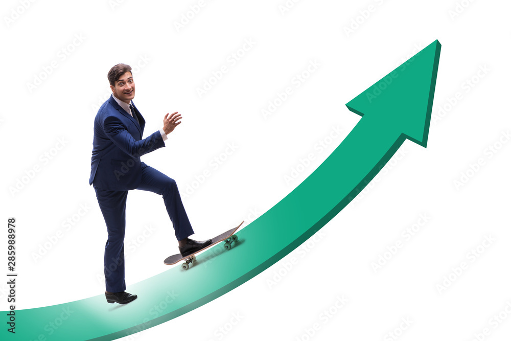 Obraz premium Businessman riding skateboard on financial graph