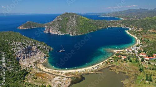Aerial drone photo of iconic paradise bay and sandy beach of Porto Koufo with turquoise calm sea protected by winds, South Sithonia Peninsula, North Greece