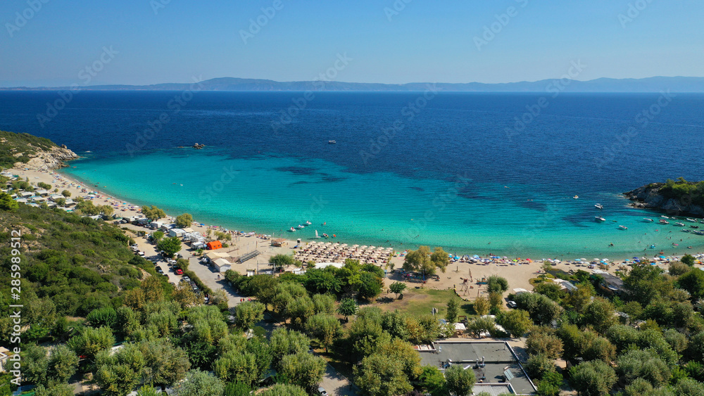Naklejka premium Aerial drone photo of iconic paradise bay and sandy beach of Porto Koufo with turquoise calm sea protected by winds, South Sithonia Peninsula, North Greece