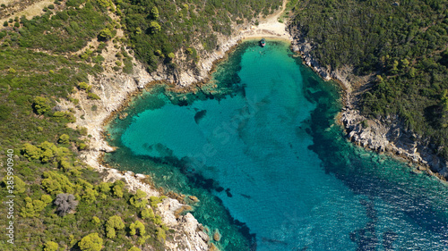 Aerial drone top down photo of heart shaped bay with turquoise clear open ocean sea in Caribbean exotic destination