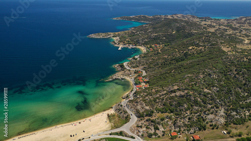 Aerial drone top down photo of secluded turquoise sandy beach of Sykia in South Sithonia peninsula, Halkidiki, North Greece