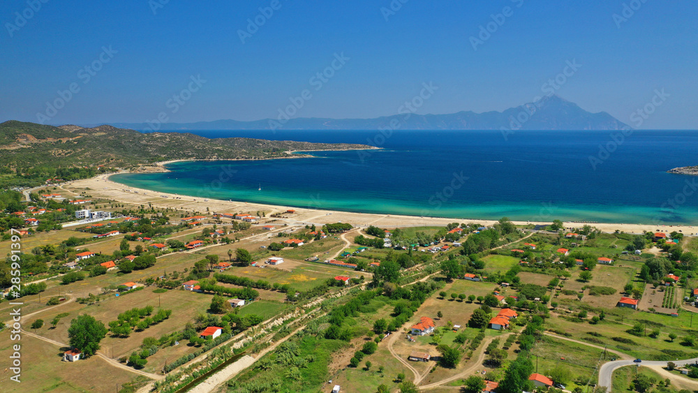 Aerial drone top down photo of secluded turquoise sandy beach of Sykia in South Sithonia peninsula, Halkidiki, North Greece