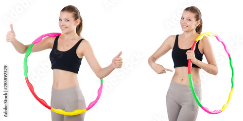 Young woman with hula hoop isolated on white © Elnur
