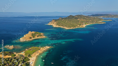Aerial drone view of paradise small secluded island complex of Drenia and Pena with turquoise and sapphire sea near famous Amouliani island in North Greece  Halkidiki