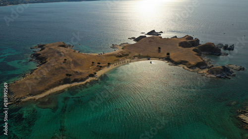 Aerial drone view of paradise small secluded island complex of Drenia and Pena with turquoise and sapphire sea near famous Amouliani island in North Greece, Halkidiki photo