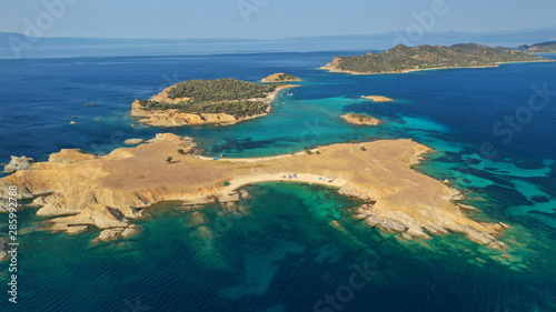 Aerial drone view of paradise small secluded island complex of Drenia and Pena with turquoise and sapphire sea near famous Amouliani island in North Greece, Halkidiki © aerial-drone