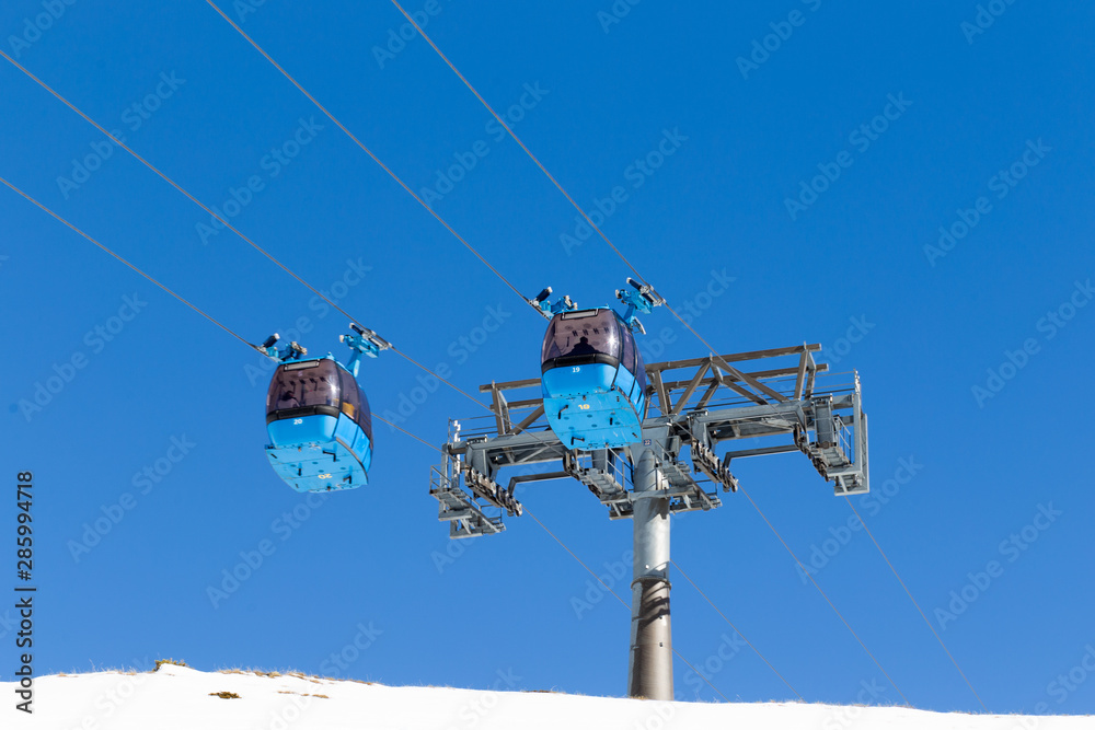 Two cabins of the cable car lift at the ski resort.