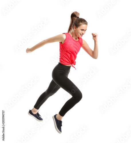 Jumping sporty woman on whi...