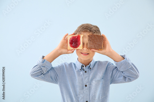 Funny little boy with tasty...