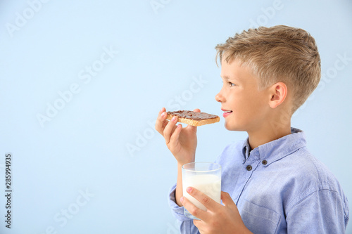 Funny little boy with tasty...