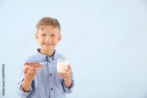 Funny little boy with tasty...