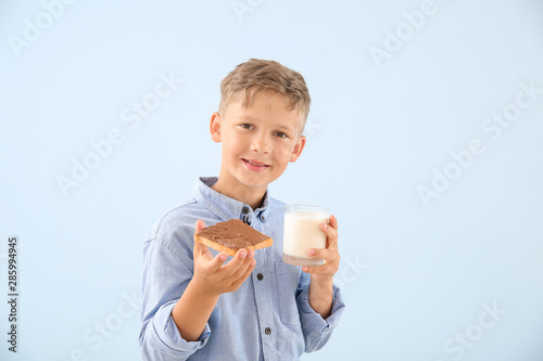 Funny little boy with tasty...