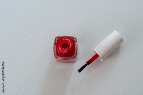 A red nail polish bottle