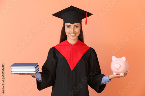 Female graduate with books ...