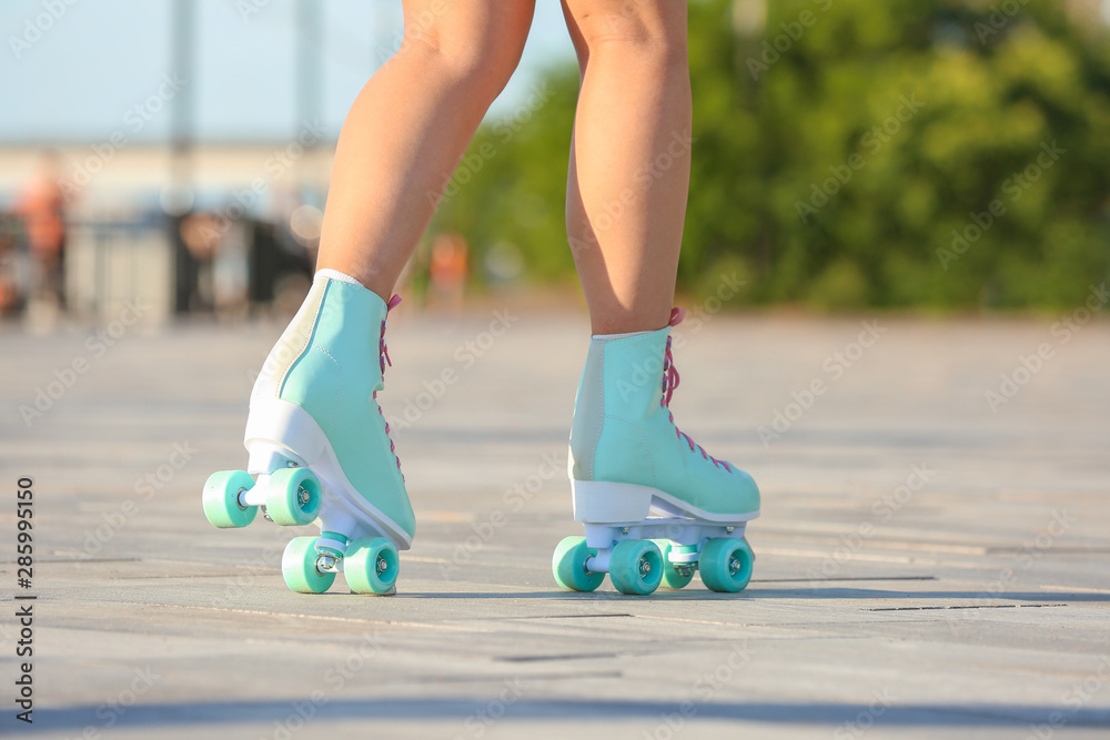 Teenage girl on roller skates outdoors