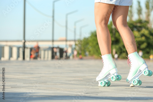 Teenage girl on roller skates outdoors