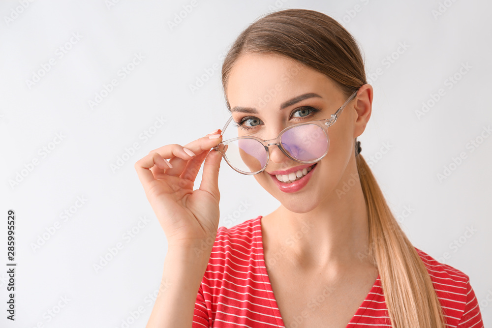 Beautiful young woman with glasses on white background Beautiful young woman with glasses on white background