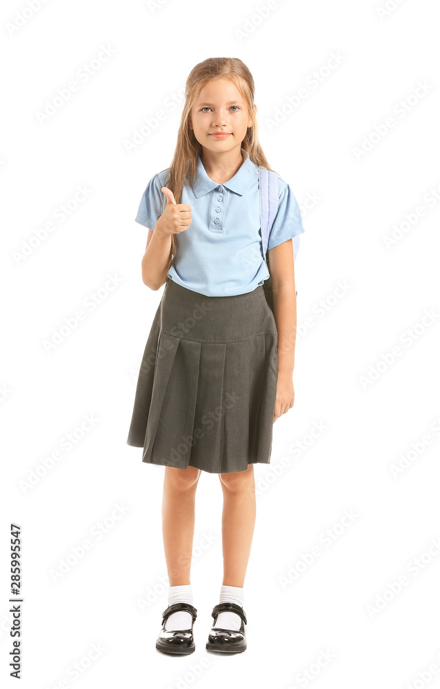Little schoolgirl showing thumb-up on white background Little schoolgirl showing thumb-up on white background