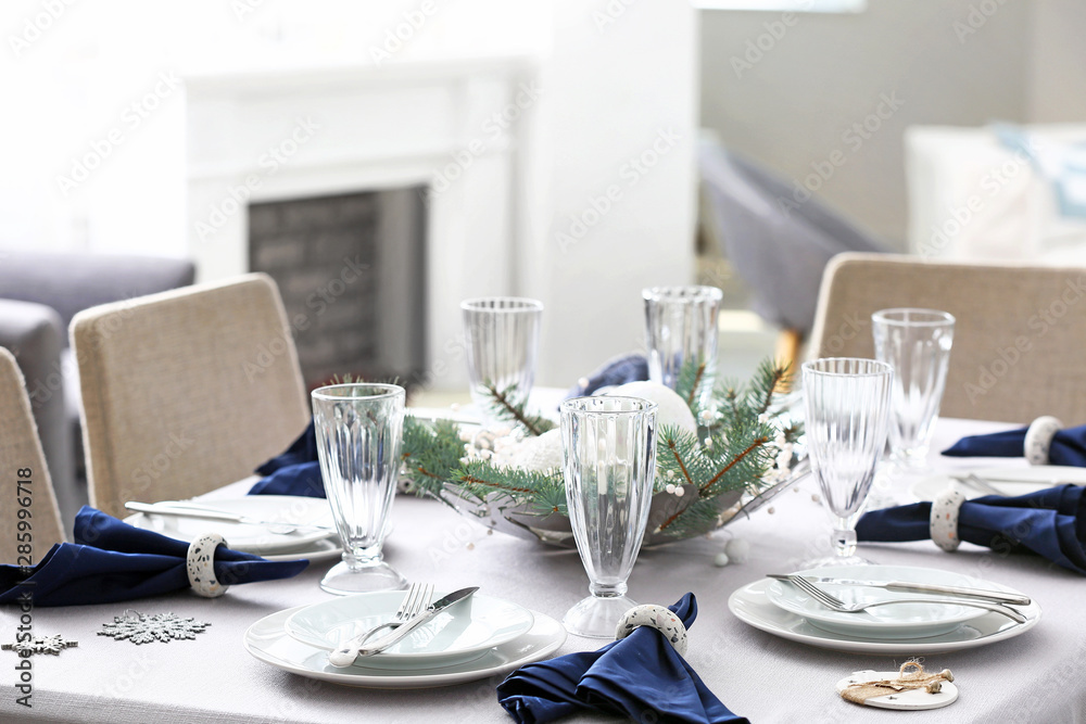 Festive table setting for Christmas dinner at home Festive table setting for Christmas dinner at home